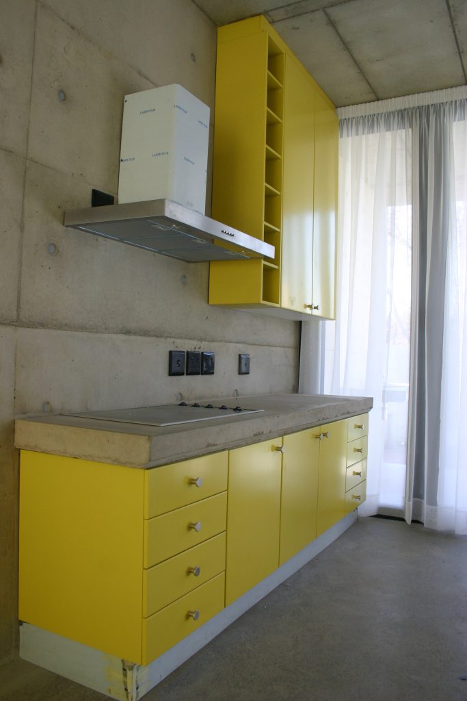 Sprayed yellow doors with concrete counter