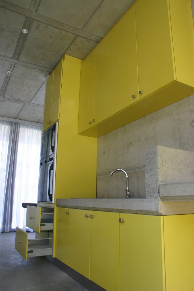 Sprayed yellow doors with concrete counter