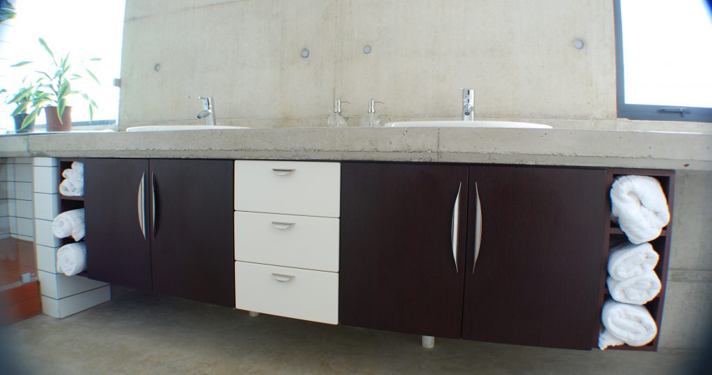 Two tone:  Vanilla and Mahogany wrap doors with concrete counter