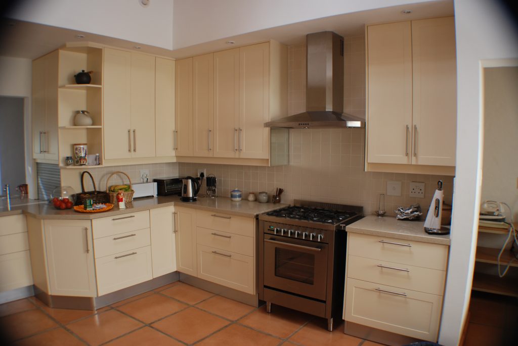 Cream sprayed doors with Technistone worktops