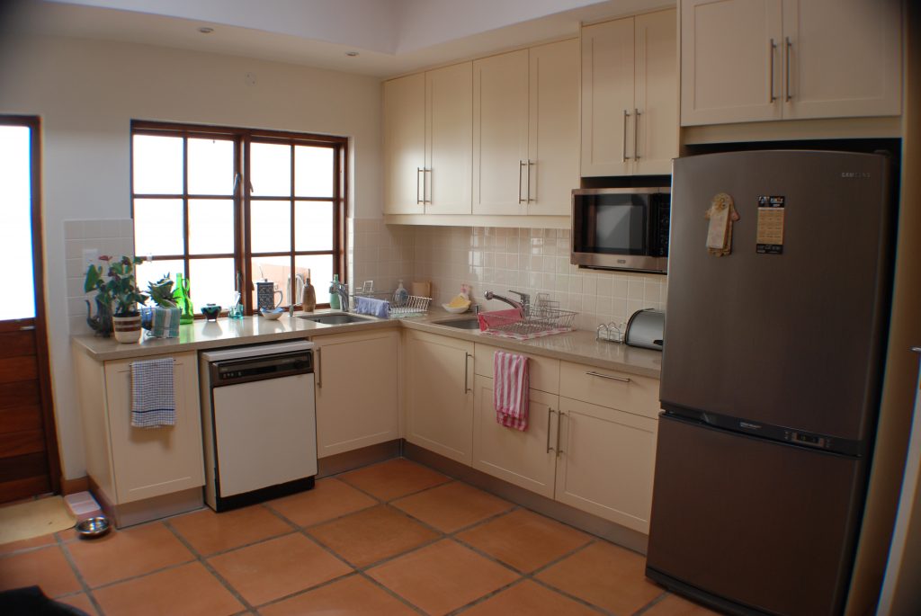 Cream sprayed doors with Technistone worktops