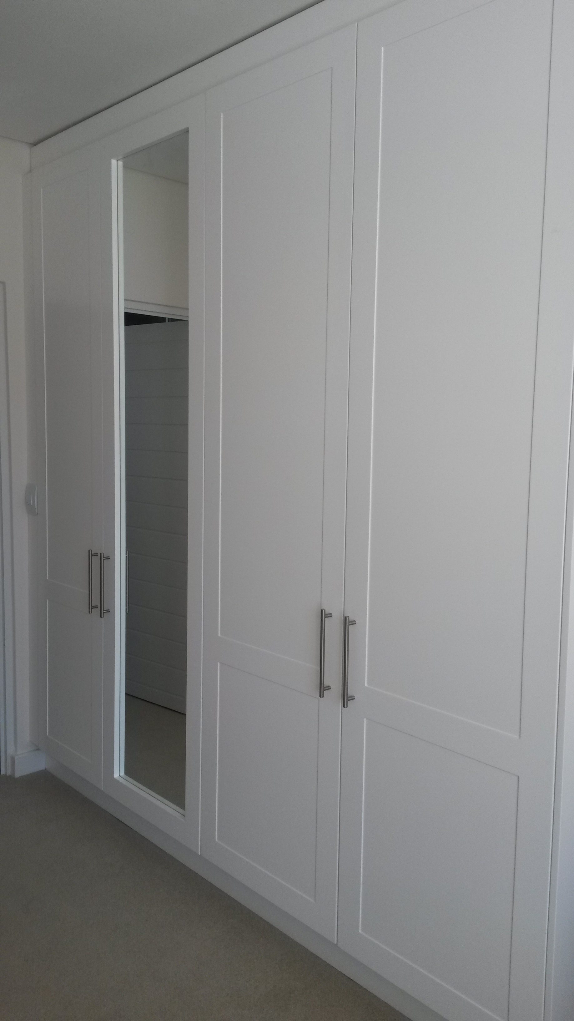 White spray painted shaker doors with full mirror in frame