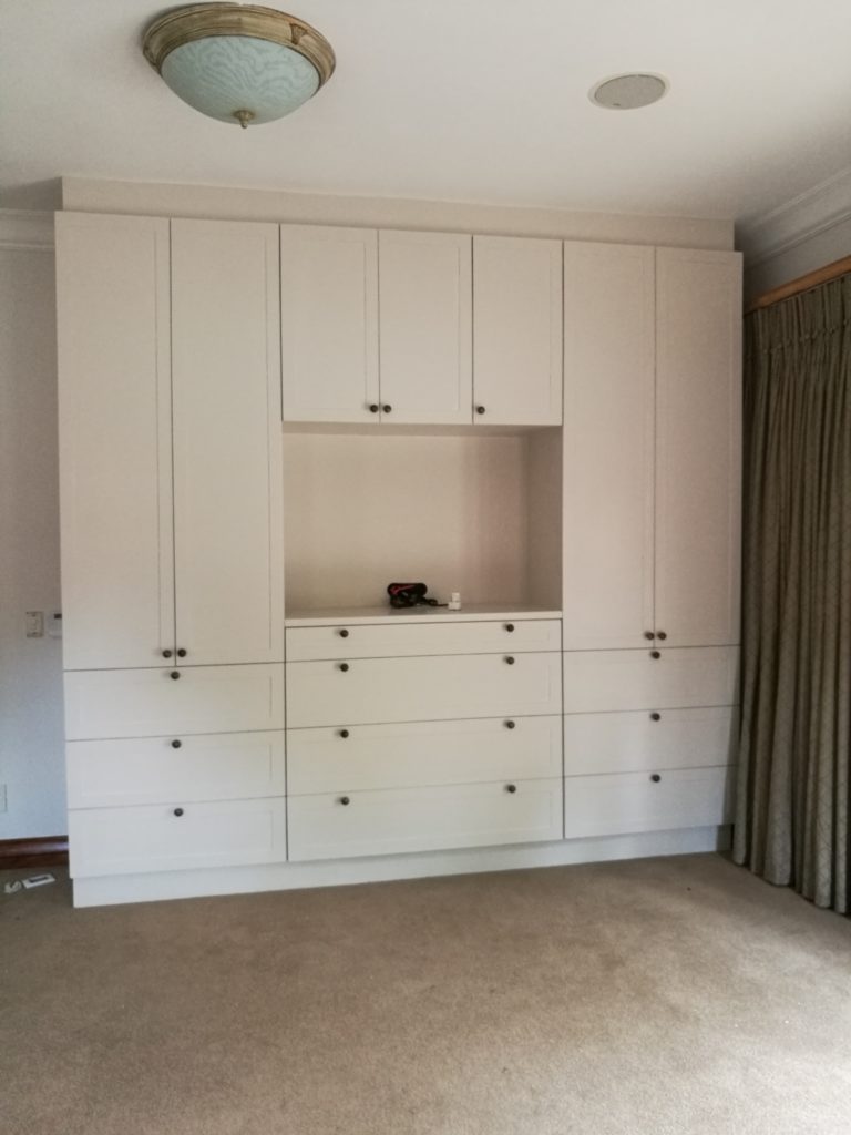 Hand painted shaker doors with space for TV and multiple drawers