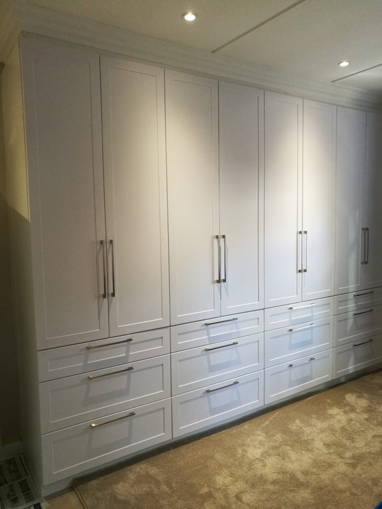 Satin white shaker wrap doors with multiple drawers