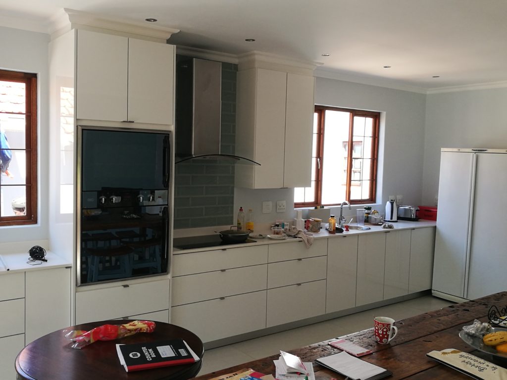 White HiGloss Acrylic doors with Sorbet Quartz work tops