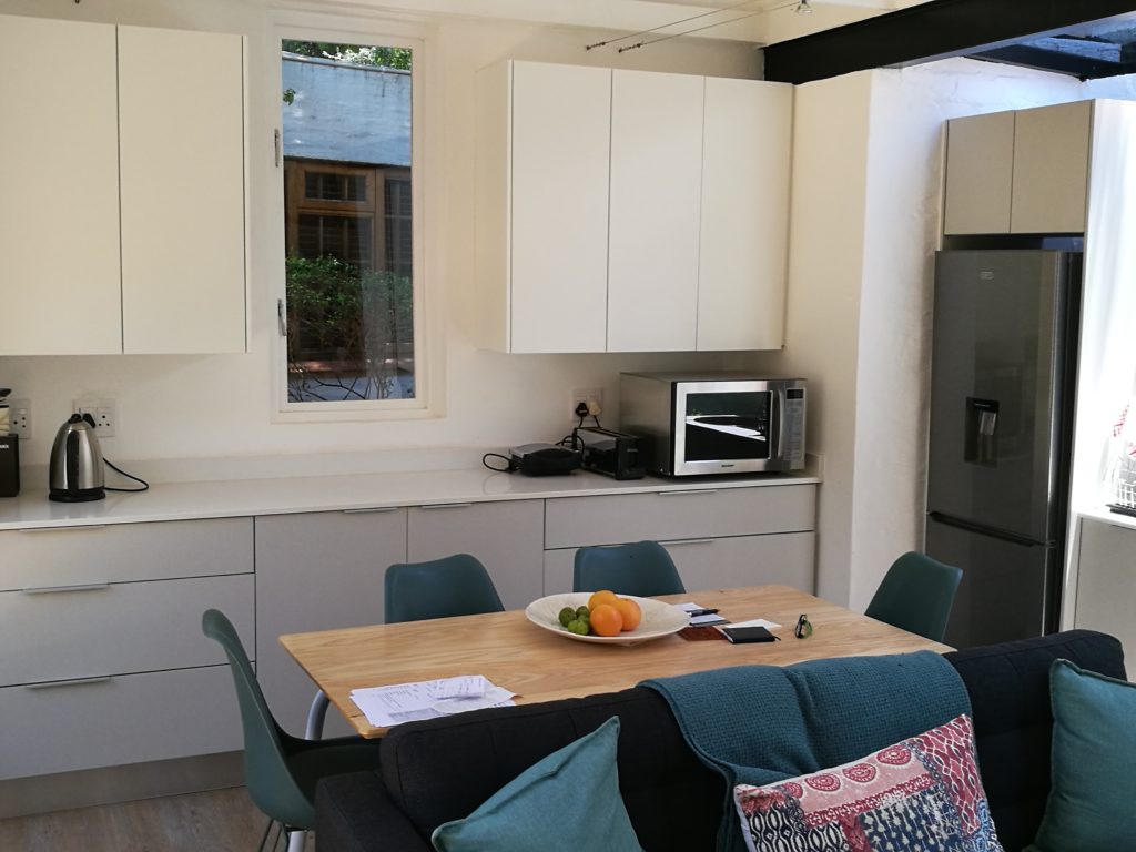 Two tone: Folkstone Grey and White Melamine doors with Sorbet work surfaces